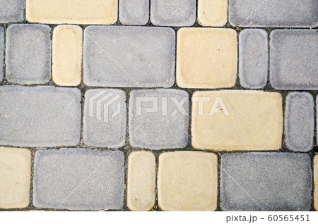 concrete yellow-blue paving slab, background 60565451