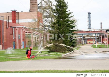 Professional firefighters in orange fire- 60565454