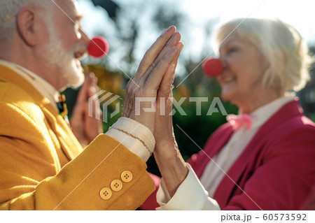 Merry senior clowns in love outdoors stock photo Merry senior clowns in love outdoors stock photo 60573592