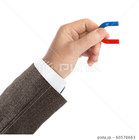 Hand with magnet Hand with magnet 60576663