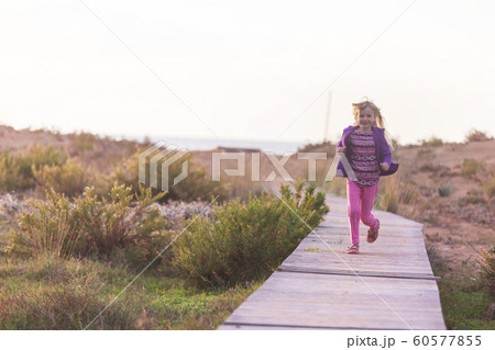 Girl on boardwalk Girl on boardwalk 60577855