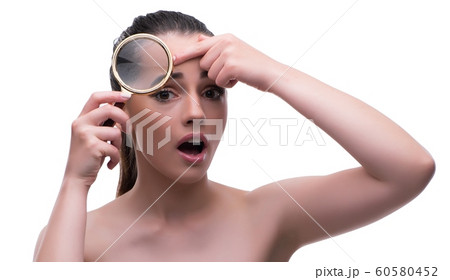 Woman in beauty concept with magnifying glass aging wrinkles Woman in beauty concept with magnifying glass aging wrinkles 60580452