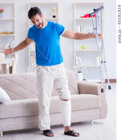 Injured young man recovering at home Injured young man recovering at home 60581839