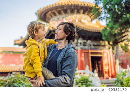 Enjoying vacation in China. Dad and son in Forbidden City. Travel to China with kids concept. Visa free transit 72 hours, 144 hours in China 60582179