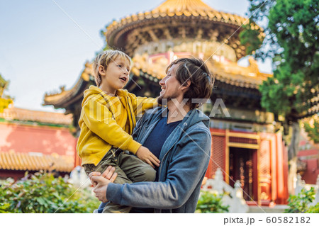 Enjoying vacation in China. Dad and son in Forbidden City. Travel to China with kids concept. Visa free transit 72 hours, 144 hours in China Enjoying vacation in China. Dad and son in Forbidden City. Travel to China with kids concept. Visa free transit 72 hours, 144 hours in China 60582182