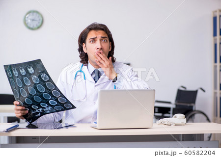 Young male doctor radiologist working in the clinic 60582204