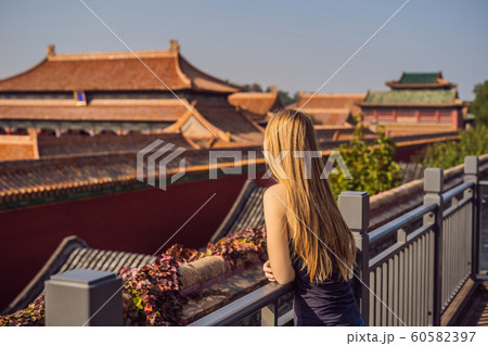 Enjoying vacation in China. Young woman in Forbidden City. Travel to China concept. Visa free transit 72 hours, 144 hours in China Enjoying vacation in China. Young woman in Forbidden City. Travel to China concept. Visa free transit 72 hours, 144 hours in China 60582397