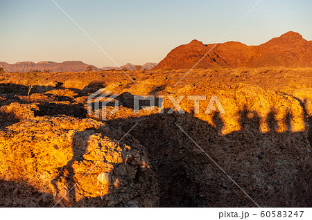 Red glowing desert rocks at Sesriem 60583247