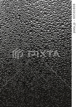 monochrome abstraction blurry drops of water on the glass. dark background for design. 60583808