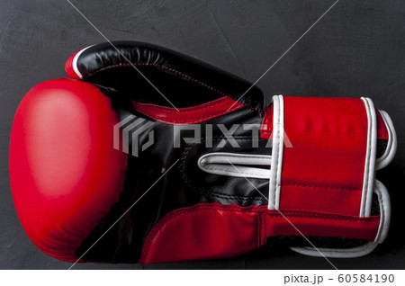 Close-up of a beautiful red-black boxing glove Close-up of a beautiful red-black boxing glove 60584190