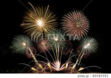 real fireworks festival in the sky for celebration at night over the sea at coast side for new year countdown celebration background 60585591