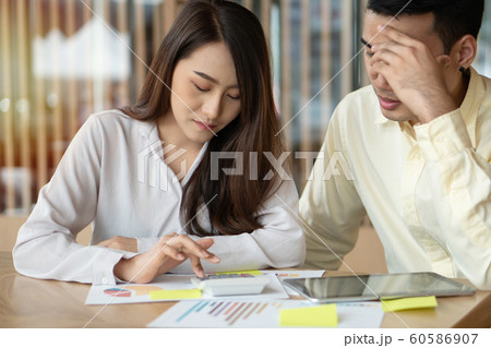 Unhappy Asian couples are calculating income And Unhappy Asian couples are calculating income And 60586907