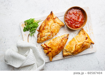 Samsa or samosas with chicken fillet 60587404