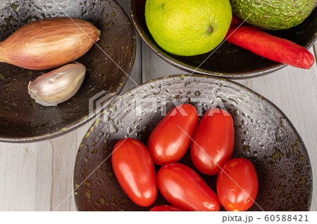 Guacamole ingredient on grey wood Guacamole ingredient on grey wood 60588421