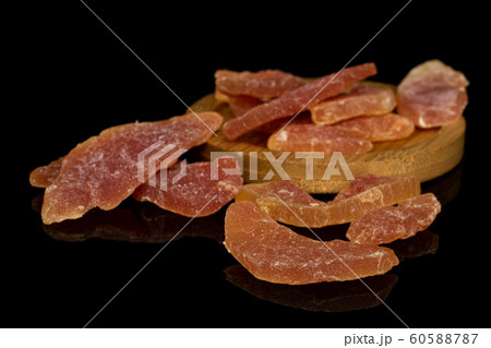 Dried orange papaya isolated on black glass 60588787