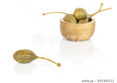 Green pickled caper isolated on white Green pickled caper isolated on white 60589331