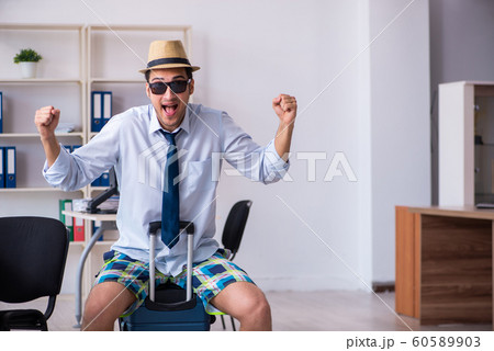 Young employee escaping for summer vacation 60589903