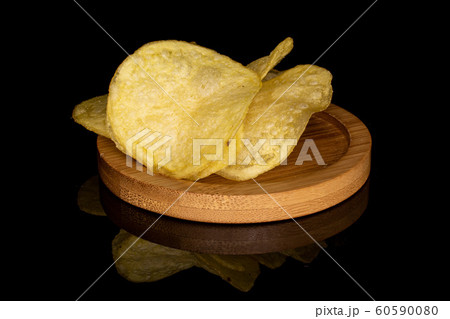 Crisp potato chip isolated on black glass 60590080