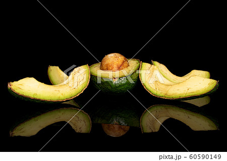 Fresh green avocado isolated on black glass Fresh green avocado isolated on black glass 60590149