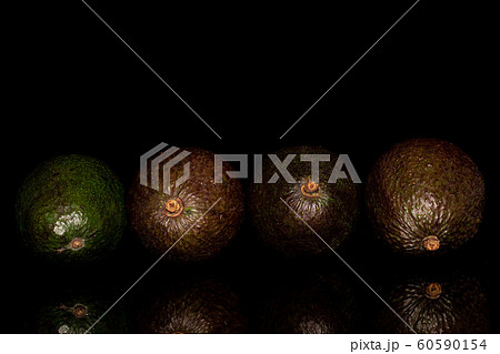 Fresh green avocado isolated on black glass 60590154