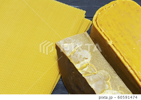 Pieces of natural bees wax. Blocks of yellow wax. 60591474