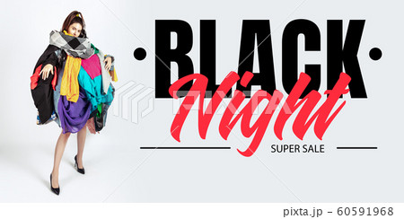 Woman addicted of sales and clothes, black night, sales concept Woman addicted of sales and clothes, black night, sales concept 60591968
