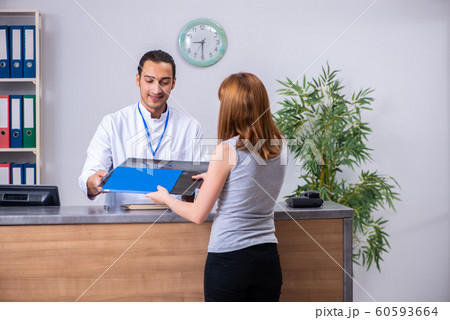 Young patient at the reception in the hospital 60593664