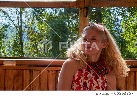 Woman sitting in a vintage train 60593857