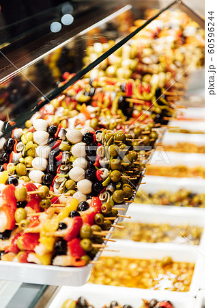 A wide variety of traditional tapas with seafood in Spain at the San Miguel market A wide variety of traditional tapas with seafood in Spain at the San Miguel market 60596244