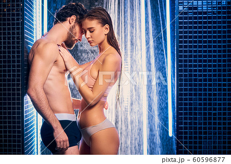 handsome man and beautiful caucasian woman in shower 60596877