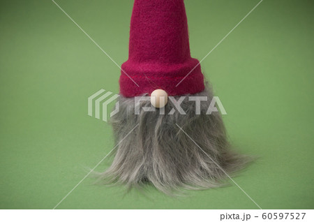 Closeup of christmas gnome on green background Closeup of christmas gnome on green background 60597527