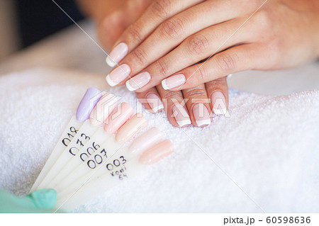 Manicure. Nails master doing manicure in beauty studio 60598636
