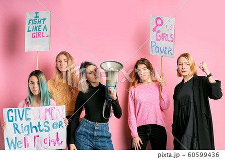 group of confident girls feminists isolated over pink background group of confident girls feminists isolated over pink background 60599436