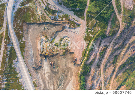 Aerial view of machine excavator trucks dig coal 60607746