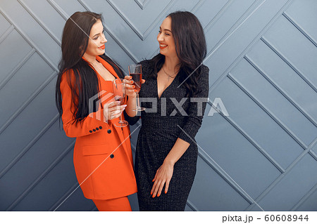 Elegant girls celebrate in the studio Elegant girls celebrate in the studio 60608944