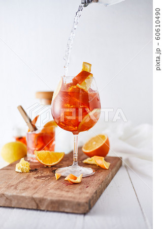 Alcoholic cocktail with orange peel and ice.. Alcoholic cocktail with orange peel and ice.. 60610490
