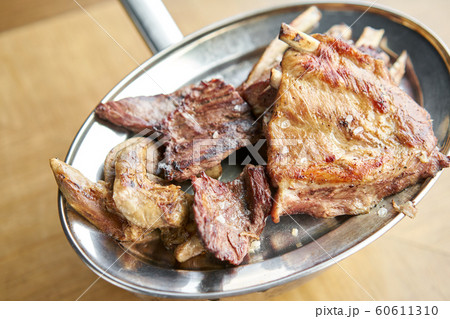 Various grilled meat set heated on coals. Barbecue restaurant menu. Many different food on the table. Dinner party or Banquet Various grilled meat set heated on coals. Barbecue restaurant menu. Many different food on the table. Dinner party or Banquet 60611310
