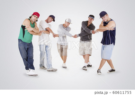 Group of young teenagers posing over white 60611755