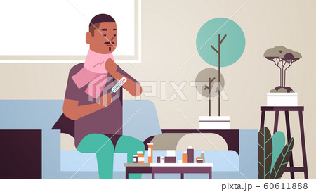 sick man measuring temperature with thermometer unhealthy african american guy in scarf suffering from cold flu virus illness concept modern living room interior flat portrait horizontal 60611888