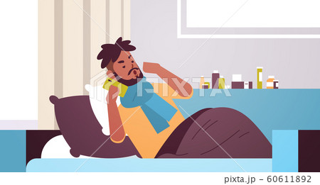 sick man having sneeze unhealthy african american guy in scarf calling phone for medical help suffering from cold flu virus illness concept modern living room interior closeup horizontal sick man having sneeze unhealthy african american guy in scarf calling phone for medical help suffering from cold flu virus illness concept modern living room interior closeup horizontal 60611892
