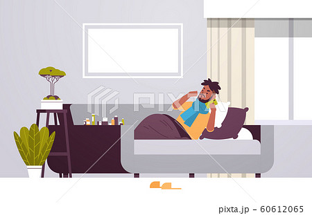 sick man having sneeze unhealthy african american guy in scarf calling phone for medical help suffering from cold flu virus illness concept modern living room interior full length horizontal sick man having sneeze unhealthy african american guy in scarf calling phone for medical help suffering from cold flu virus illness concept modern living room interior full length horizontal 60612065