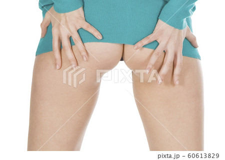 Attractive female wearing in a dress posing over 60613829