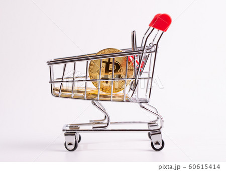 Bitcoin in a cart as a symbol of the purchase of 60615414