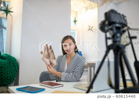 Young brunette woman presenting very beautiful shoes Young brunette woman presenting very beautiful shoes 60615440