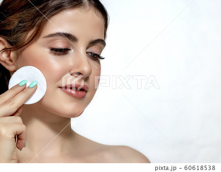 Beautiful young woman with clean perfect skin. Beautiful young woman with clean perfect skin. 60618538