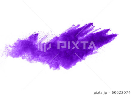 Powder explosion. Closeup of a purple dust particle explosion isolated on white. Abstract background. Powder explosion. Closeup of a purple dust particle explosion isolated on white. Abstract background. 60622074