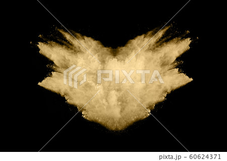 Golden powder explosion on black background. Golden powder explosion on black background. 60624371