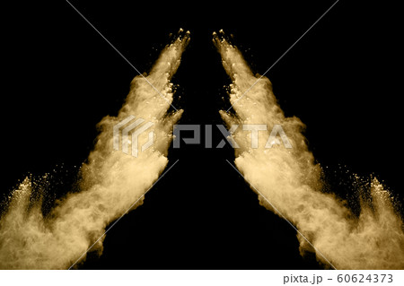 Golden powder explosion on black background. Golden powder explosion on black background. 60624373