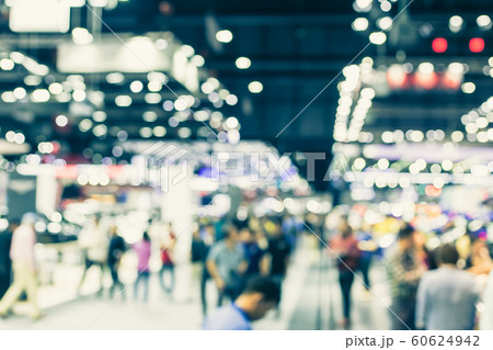 Blur event hall in large exhibition center with people walking Blur event hall in large exhibition center with people walking 60624942