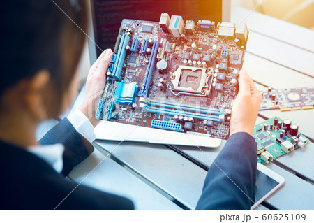 Engineer inspect final production of Printed circuit computer logic board 60625109